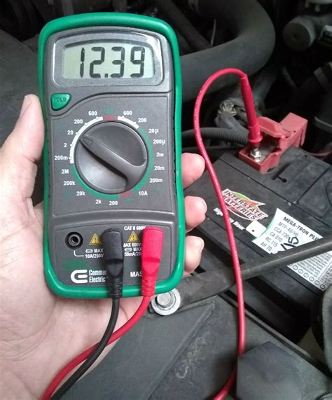 test car battery with multimeter